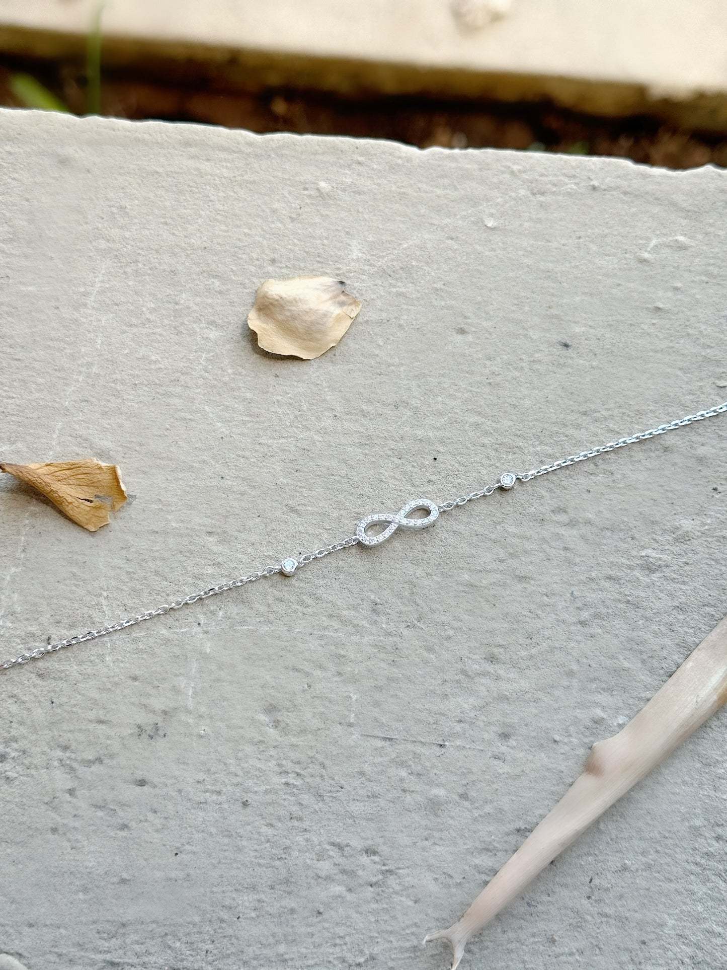 Infinity Design Bracelet with Two Round Stones